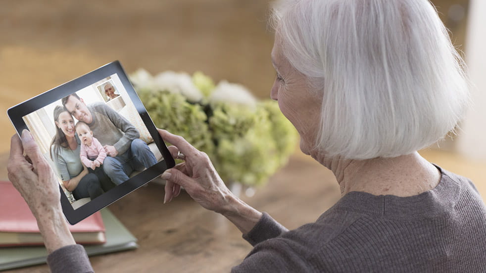 How to keep in touch with loved ones; grey haired woman
